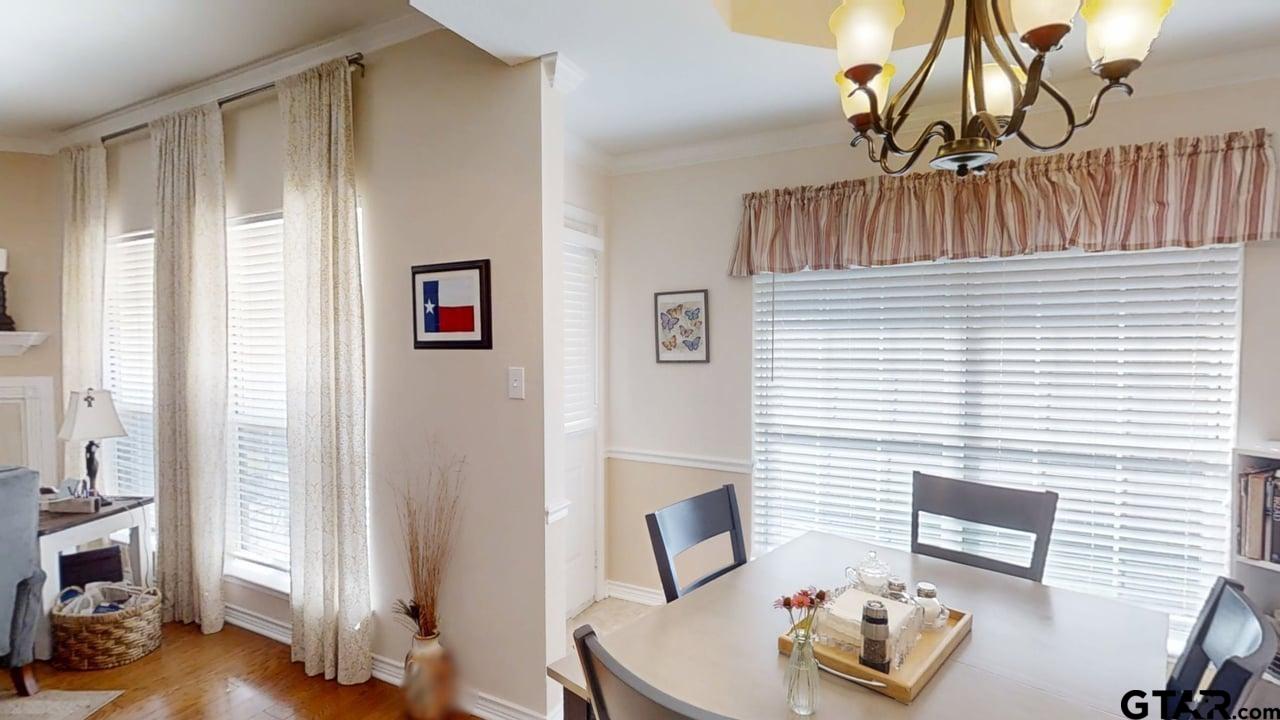 1202 Rice Road, Unit 143 Tyler, TX 75703 - Photo 9 of 27 a bedroom with furniture and a window