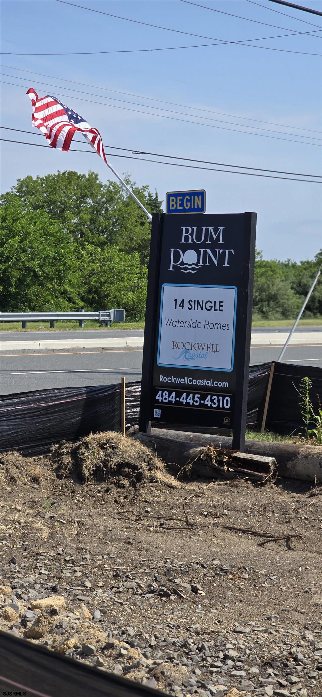 2 Rum Point Court Brigantine, NJ 00000 - Photo 1 of 1 a sign that is on the side of a road