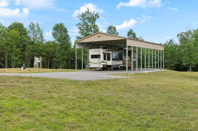 a front view of a building with a garden