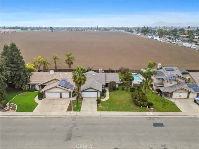 an aerial view of a house with outdoor space