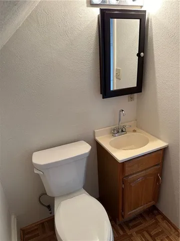 a house that has a tree in front of it