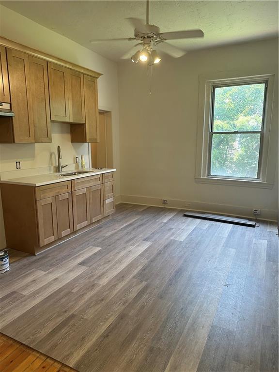 324 Ophelia Street Pittsburgh, PA 15213 - Photo 3 of 16 a view of a kitchen with a sink cabinets and wooden floor