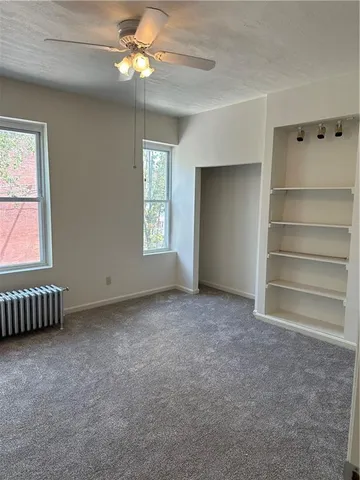 a bathroom with a double vanity sink a toilet and a mirror