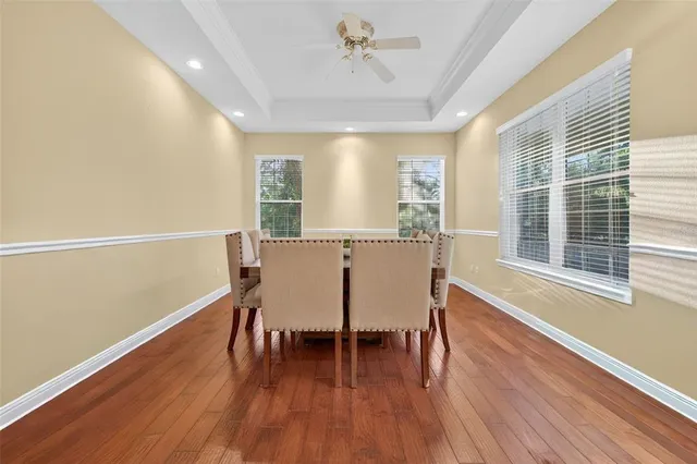 a view of a dining room with furniture window and wooden floor