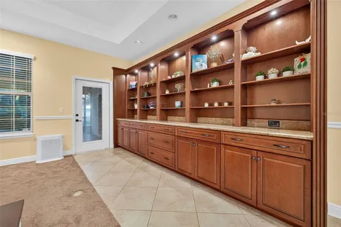 a kitchen with granite countertop a sink and cabinets