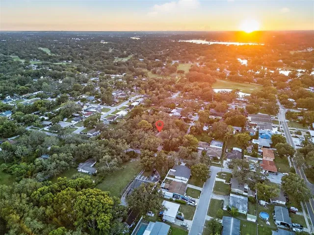an aerial view of residential houses with city view and lake view