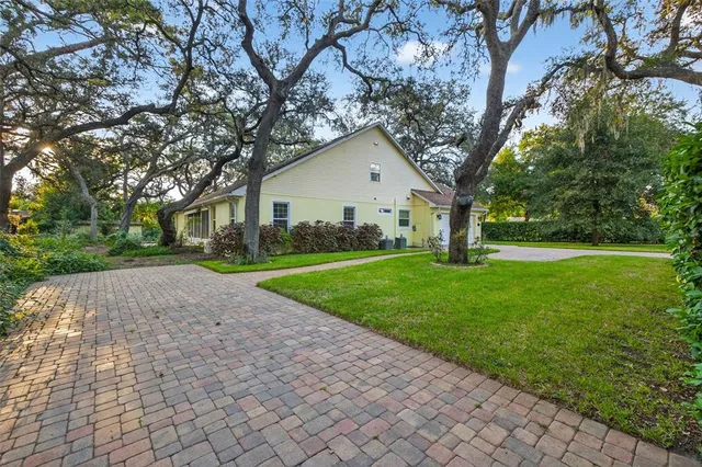 a front view of house with yard and green space