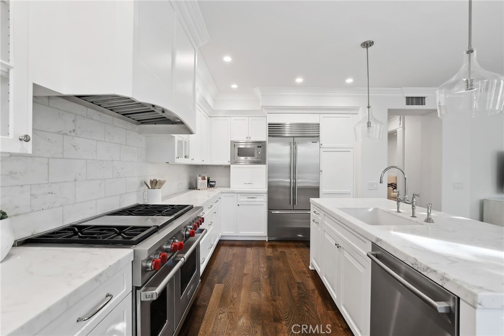 18 Lyon Newport Coast, CA 92657 - Photo 14 of 55 a kitchen that has a sink a refrigerator and a stove