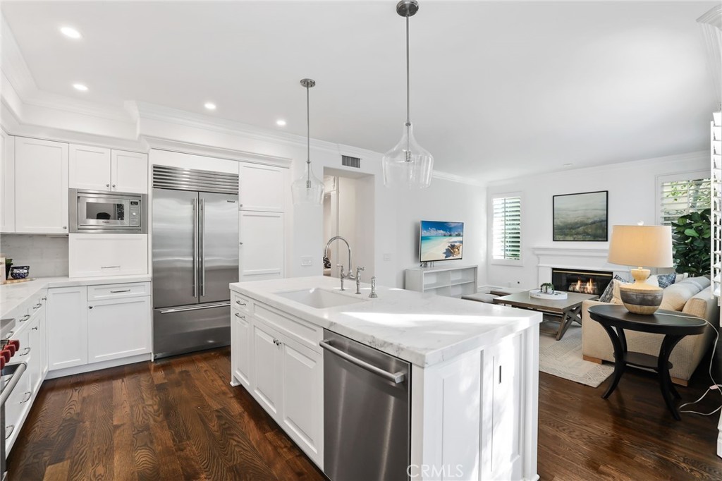 18 Lyon Newport Coast, CA 92657 - Photo 15 of 55 a kitchen with a sink stainless steel appliances and white cabinets