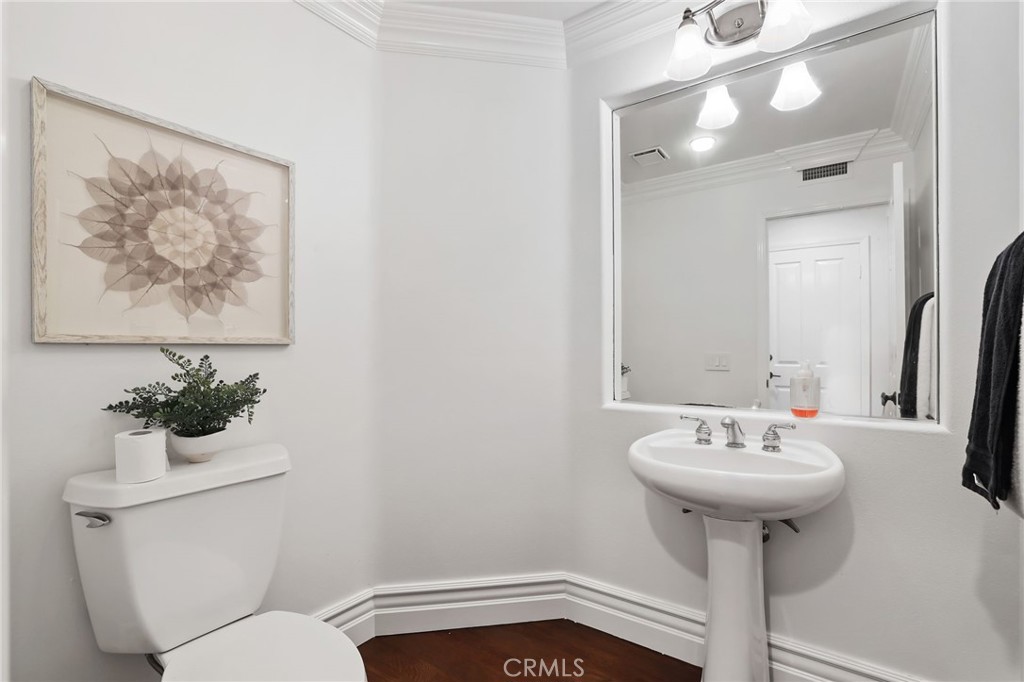 18 Lyon Newport Coast, CA 92657 - Photo 21 of 55 a bathroom with a sink mirror and toilet
