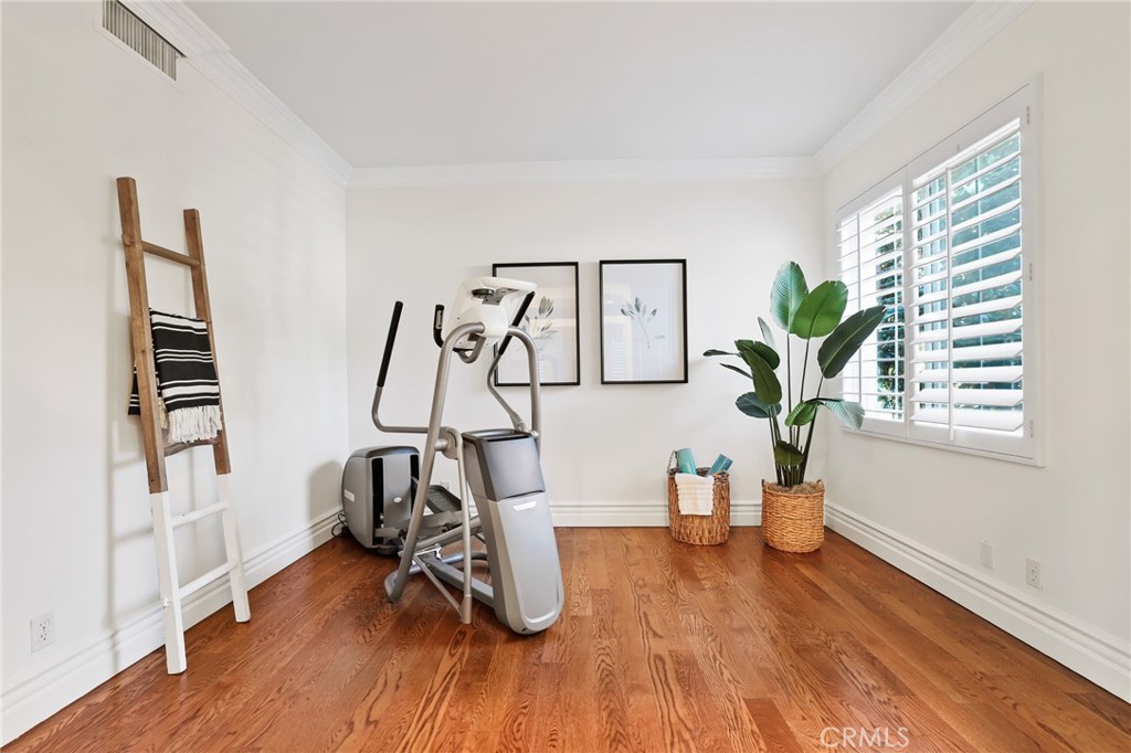 18 Lyon Newport Coast, CA 92657 - Photo 26 of 55 a view of a room with gym equipment and wooden floor