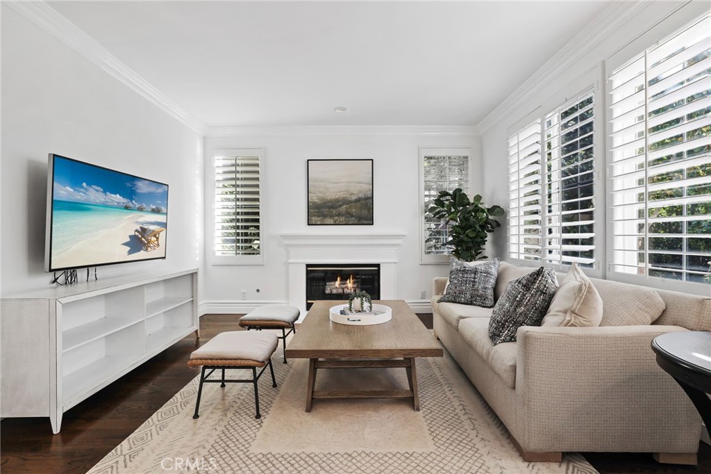 18 Lyon Newport Coast, CA 92657 - Photo 9 of 55 a living room with furniture a fireplace and a large window