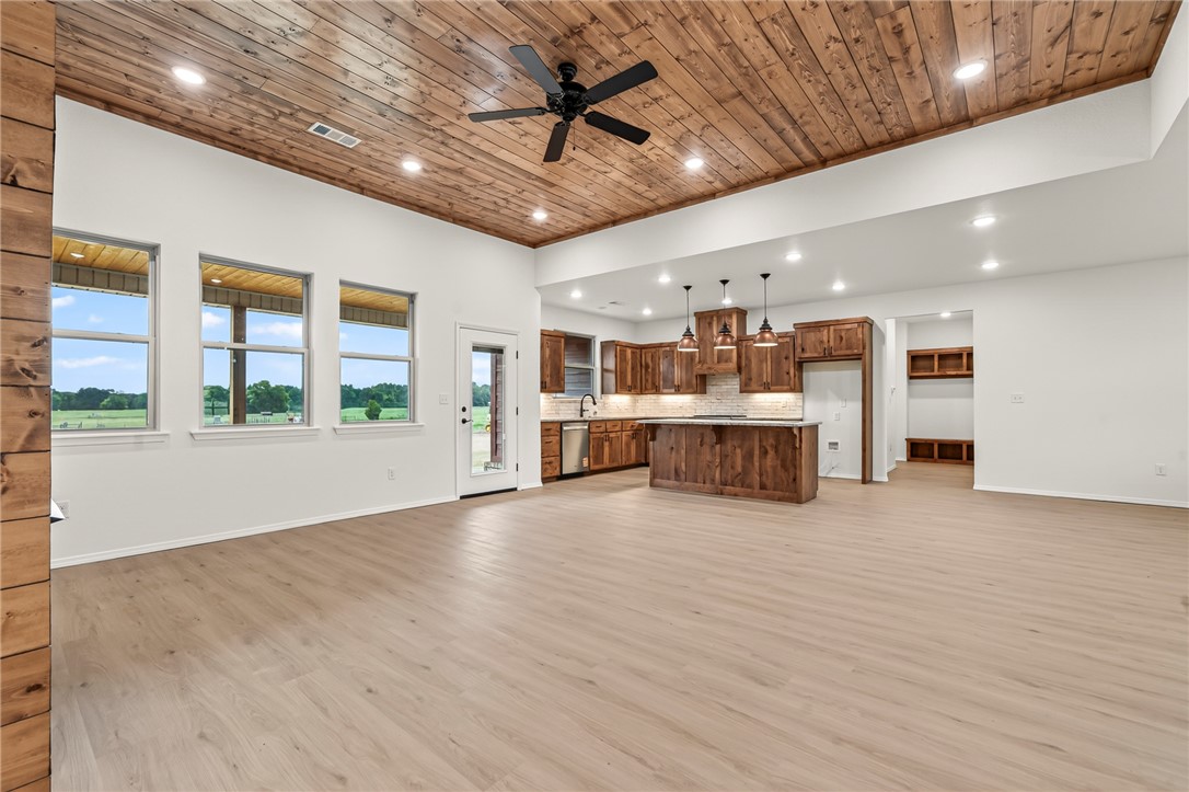 6138 New Hope Road Hackett, AR 72937 - Photo 45 of 56 Expansive wood-finish flooring with a wood-plank ceiling, recessed lighting, and a ceiling fan