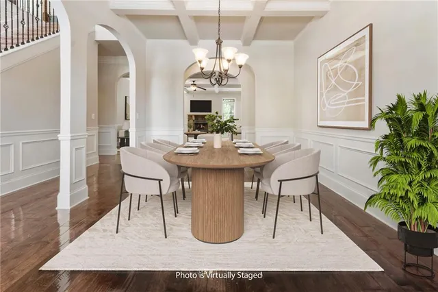a view of a livingroom with a fireplace and chandelier fan