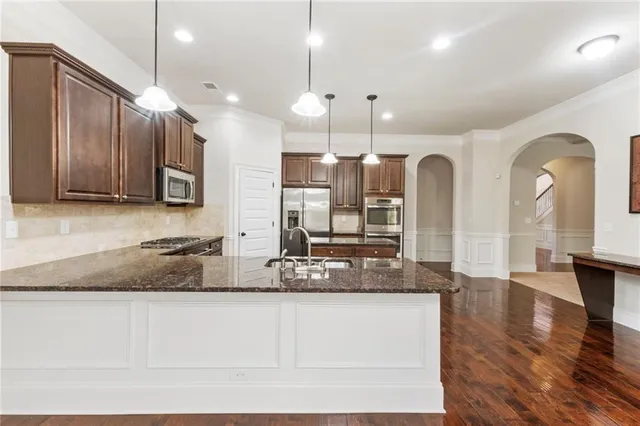 a view of an empty room with a fireplace and a window