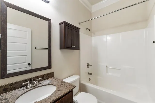 a living room with furniture potted plant and a window
