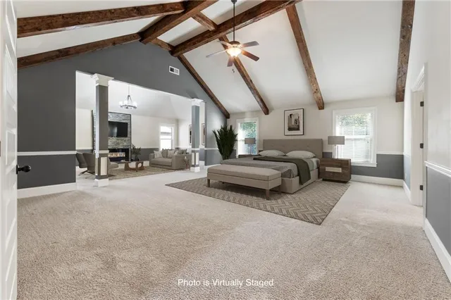a spacious bathroom with a bathtub a sink and a mirror