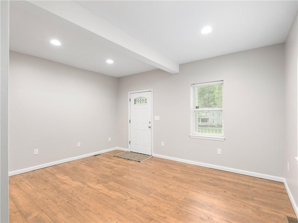 2031 Monroeville Road Monroeville, PA 15146 - Photo 13 of 25 an empty room with wooden floor and windows