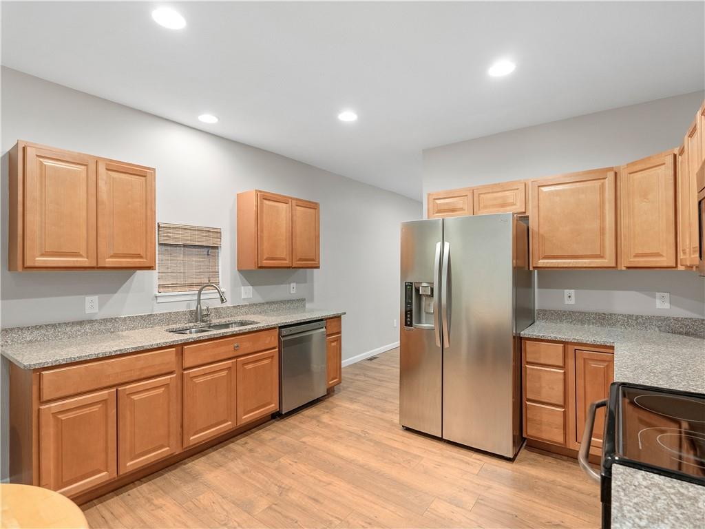 2031 Monroeville Road Monroeville, PA 15146 - Photo 16 of 25 a kitchen with stainless steel appliances granite countertop a refrigerator and a sink