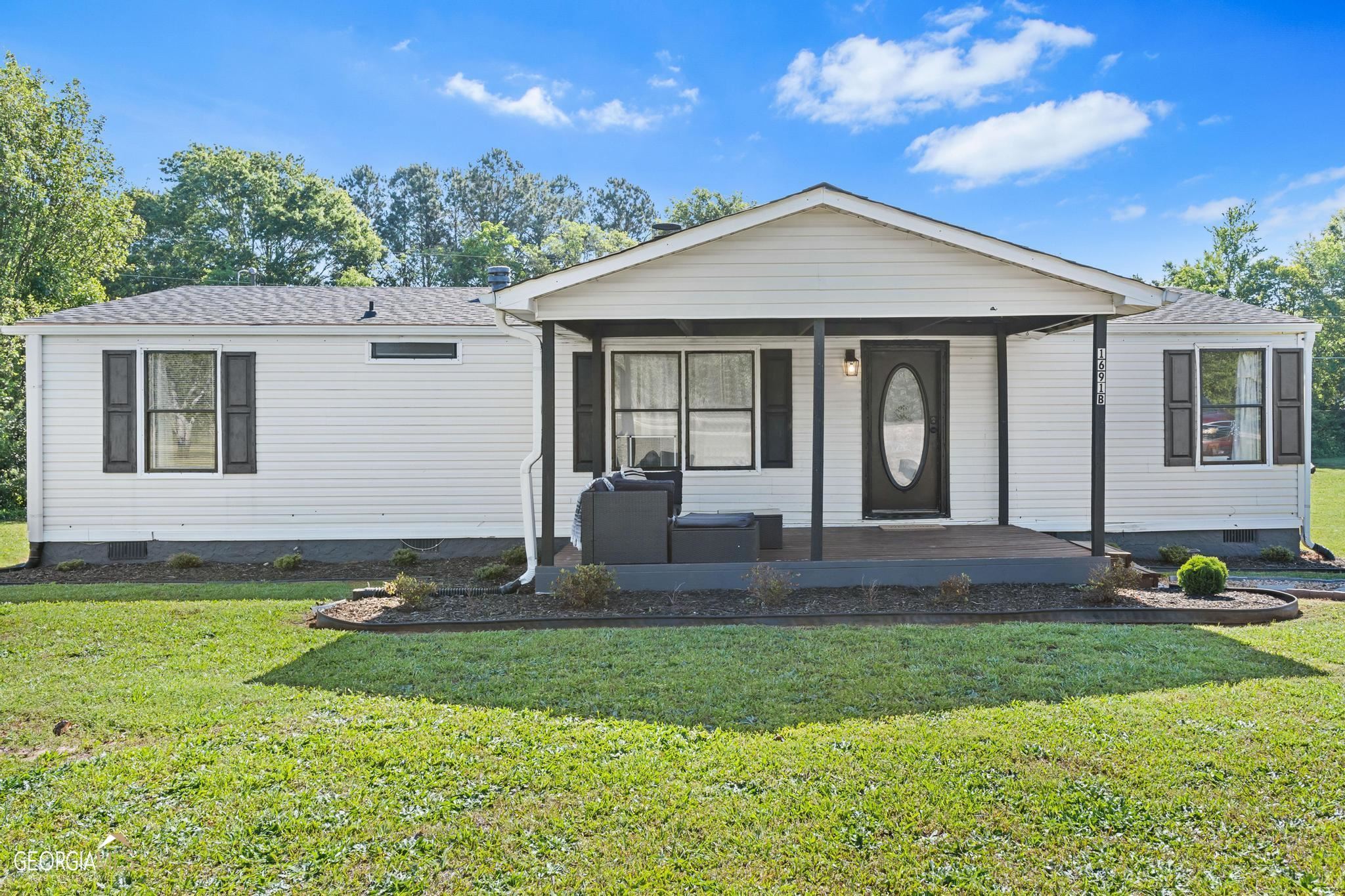 1691 B Rover Zetella Road Williamson, GA 30292 - Photo 1 of 1 a front view of a house with a yard
