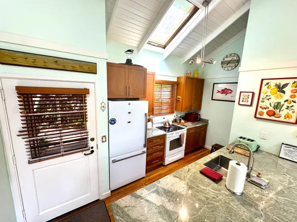 a living room with furniture a rug and a window