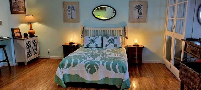 an aerial view of a house with a garden and lake view