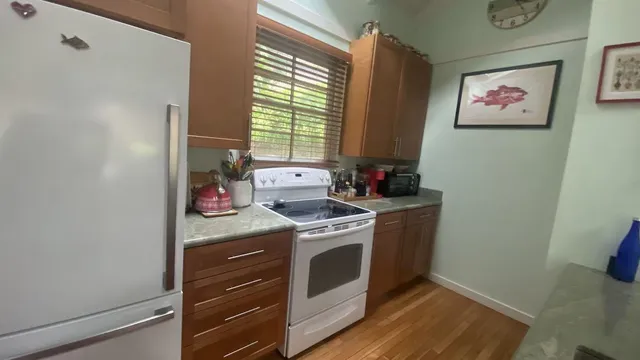 a kitchen with a stove and a refrigerator