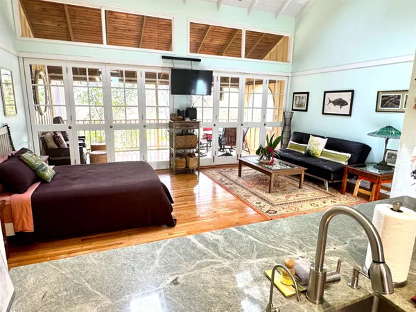 a bathroom with a toilet a sink and a mirror