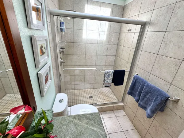 a view of a chairs and table in the balcony