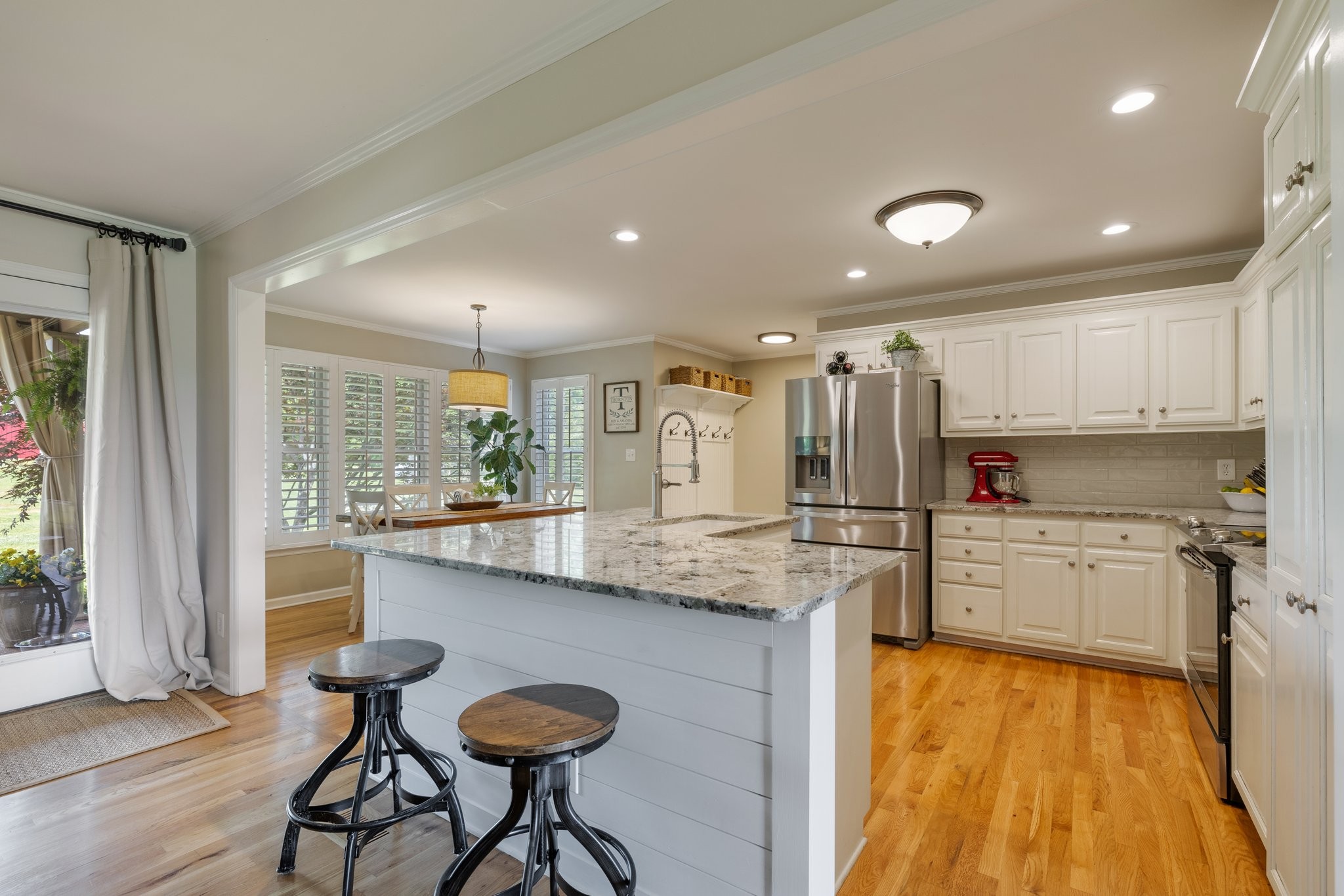 6223 Ladd Road Franklin, TN 37067 - Photo 12 of 67 a kitchen with kitchen island a counter top space a sink stainless steel appliances and cabinets