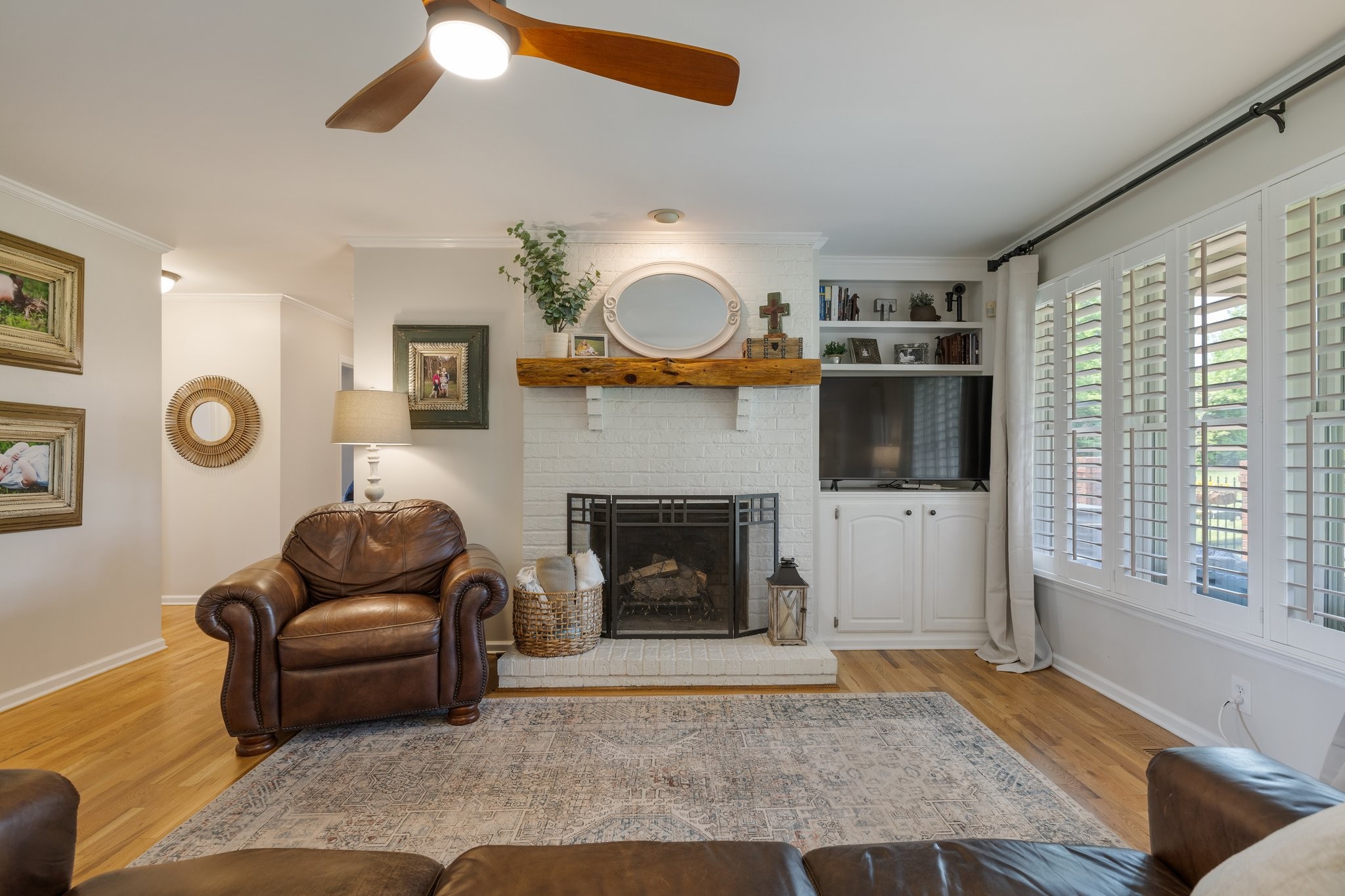 6223 Ladd Road Franklin, TN 37067 - Photo 18 of 67 a living room with furniture and a fireplace