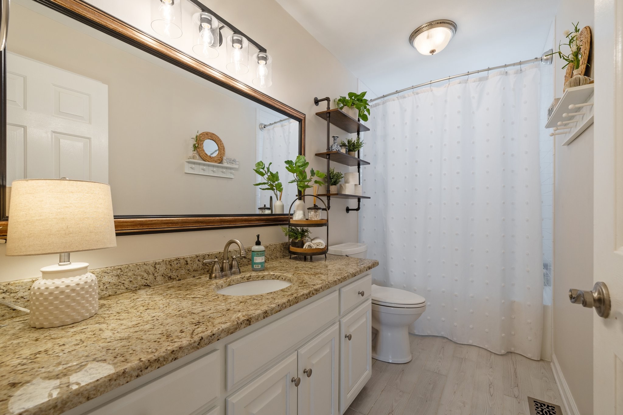 6223 Ladd Road Franklin, TN 37067 - Photo 24 of 67 a bathroom with a granite countertop sink and a mirror