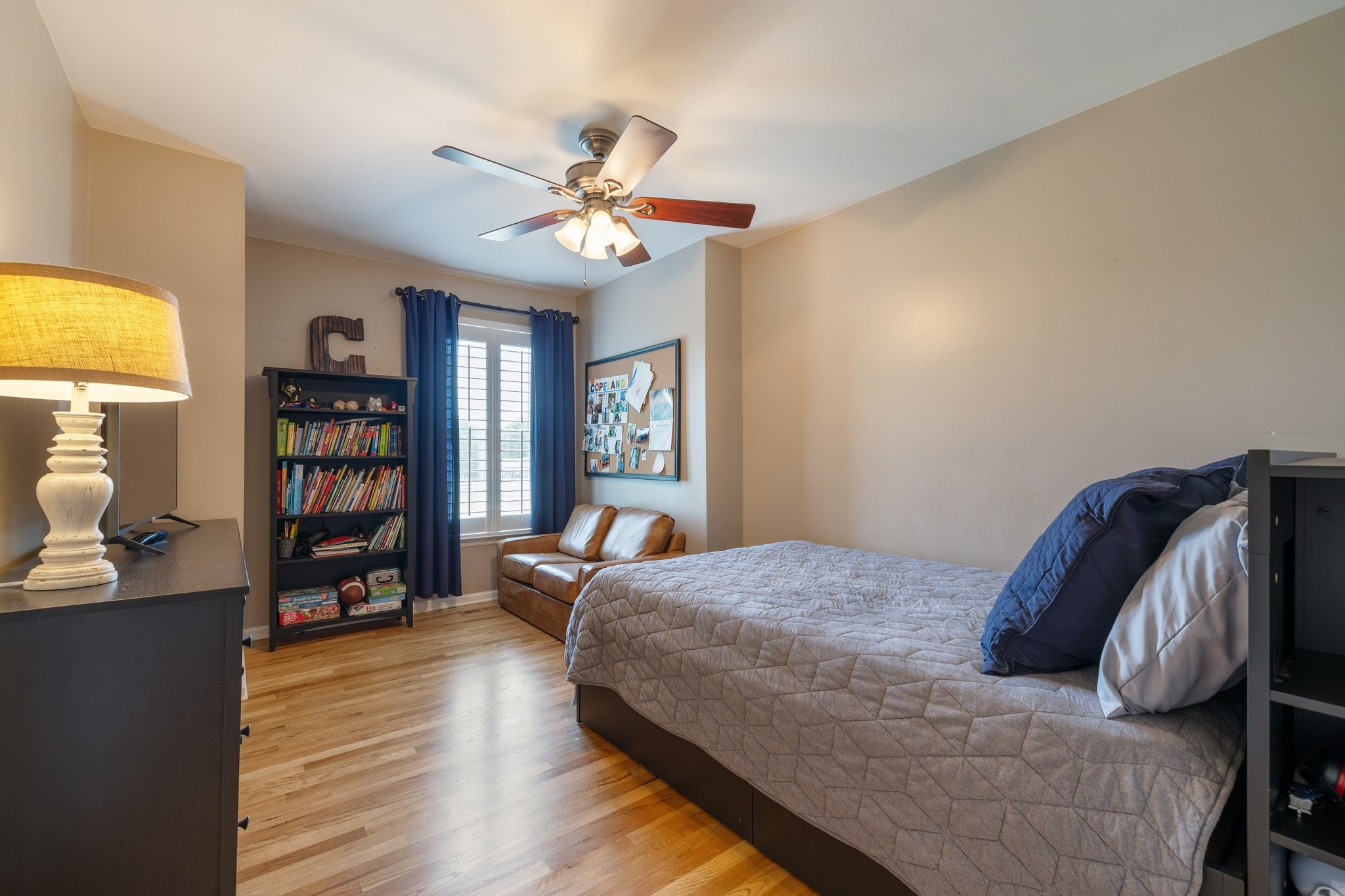 6223 Ladd Road Franklin, TN 37067 - Photo 25 of 67 a bedroom with a bed and a bookshelf