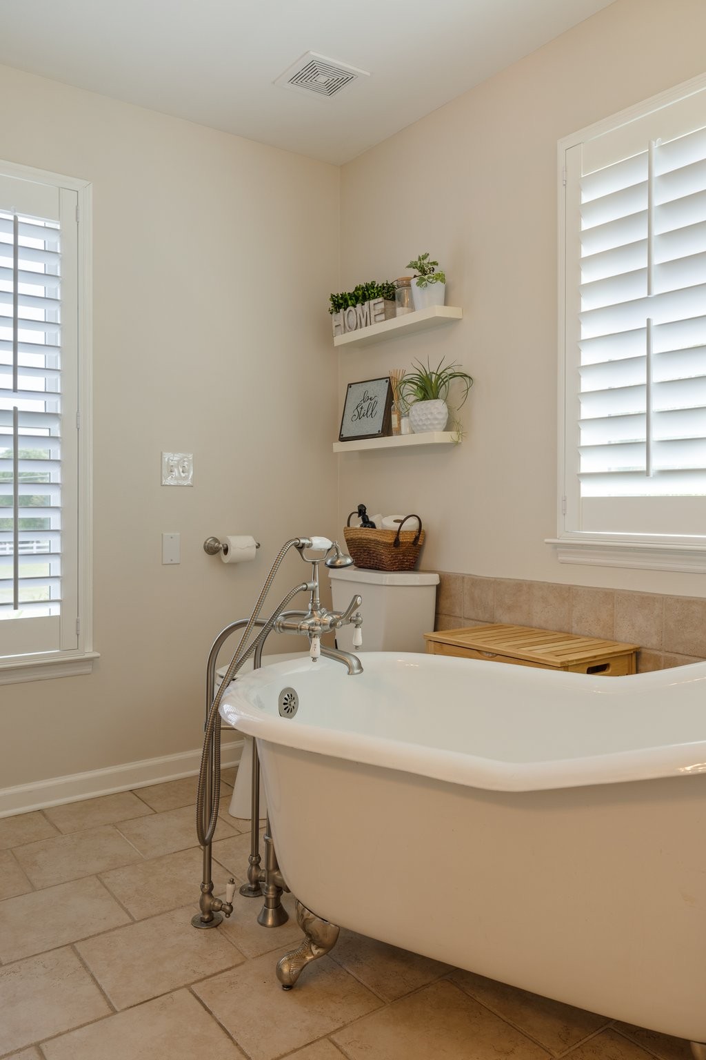 6223 Ladd Road Franklin, TN 37067 - Photo 29 of 67 a bath tub sitting next to a white sink and a window