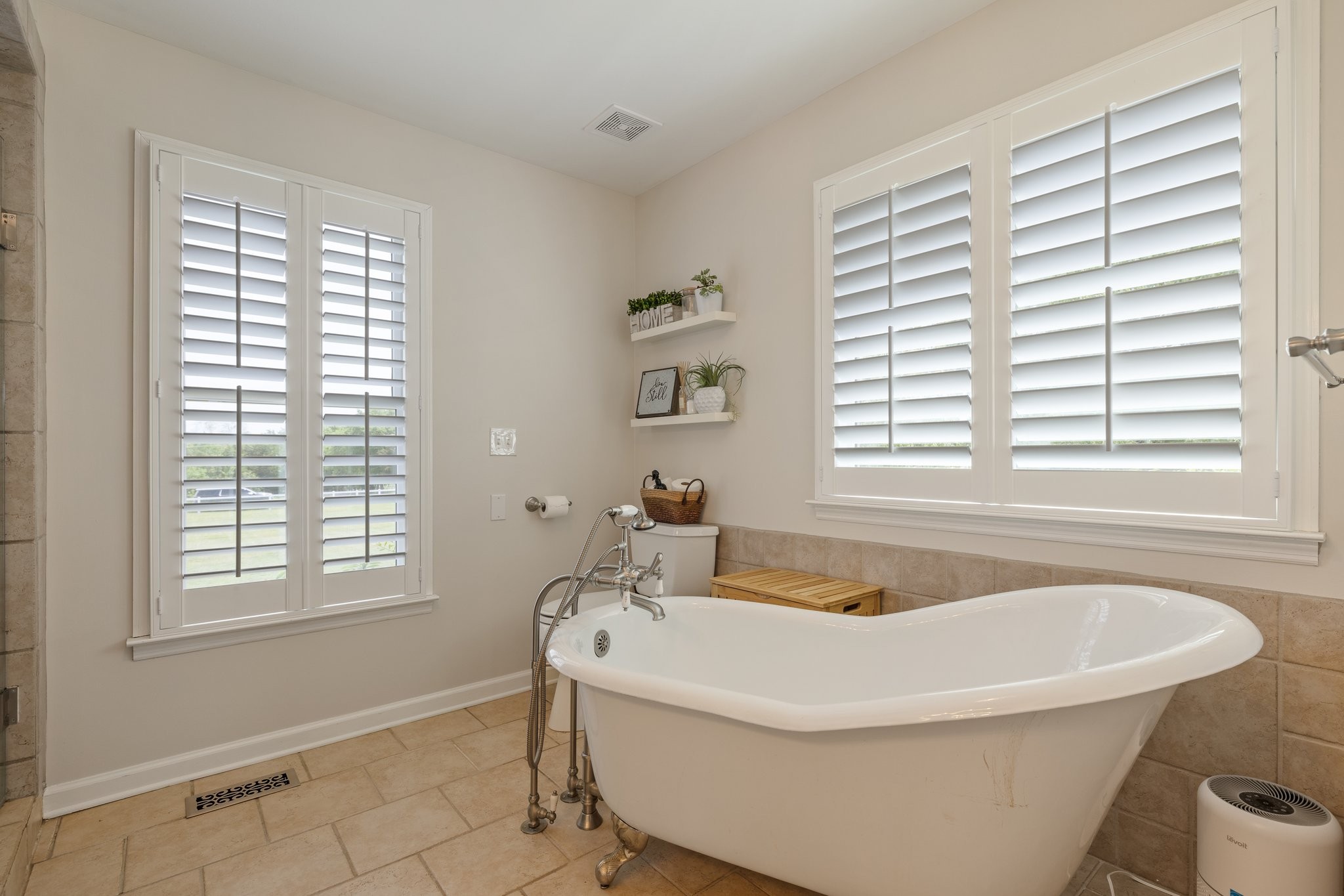 6223 Ladd Road Franklin, TN 37067 - Photo 30 of 67 a white bath tub sitting in a bathroom next to a window