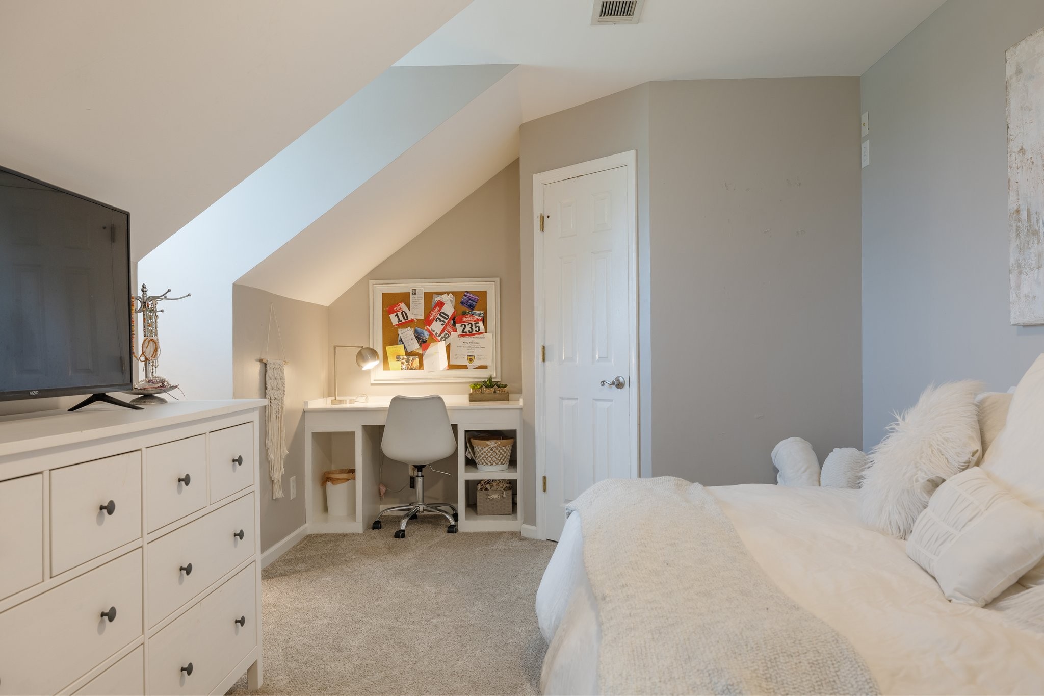 6223 Ladd Road Franklin, TN 37067 - Photo 39 of 67 a bedroom with a bed and a flat tv screen on the dresser