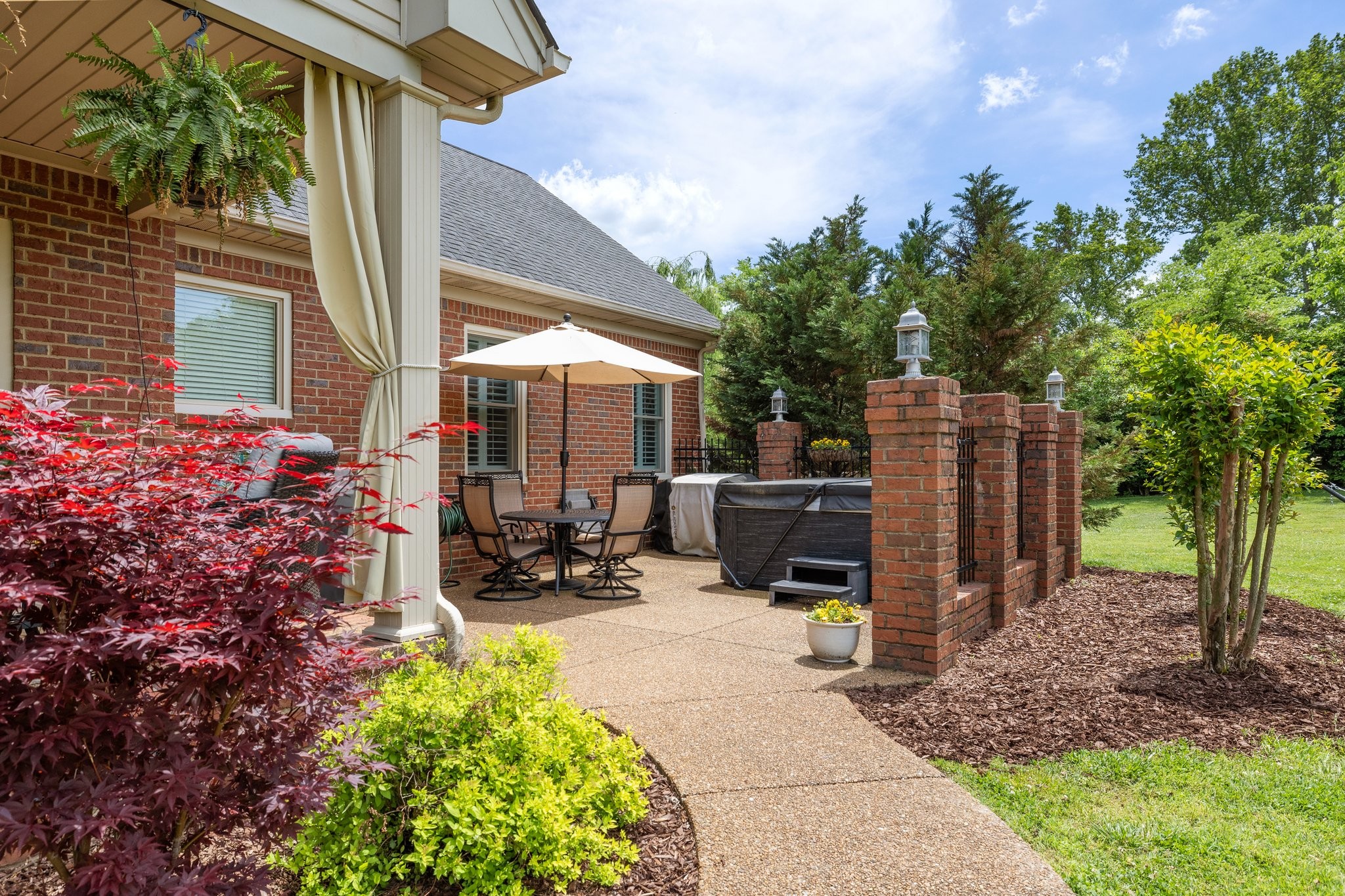 6223 Ladd Road Franklin, TN 37067 - Photo 44 of 67 a view of a backyard with plants and a patio