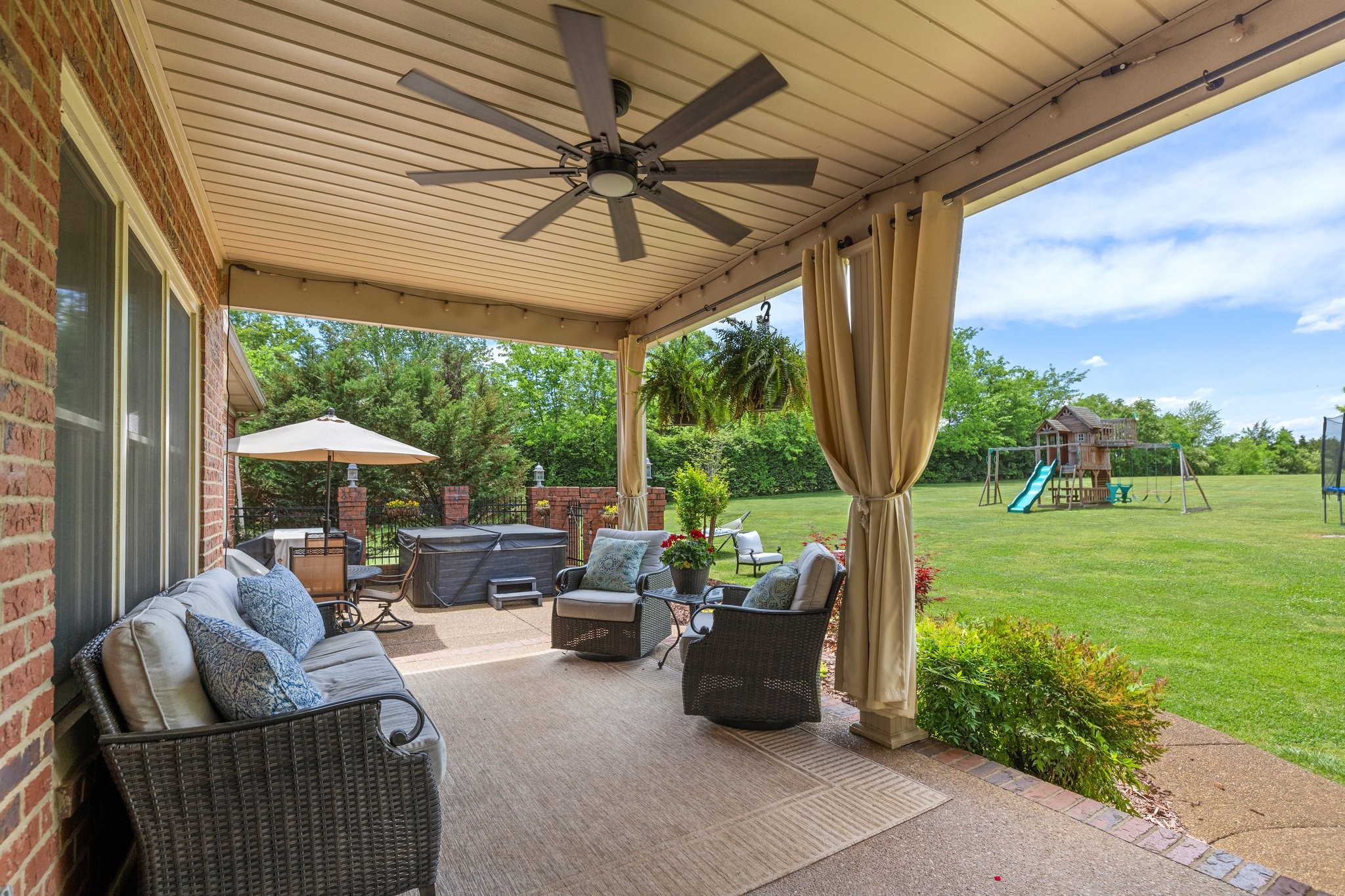 6223 Ladd Road Franklin, TN 37067 - Photo 46 of 67 a view of a patio with couches chairs under an umbrella