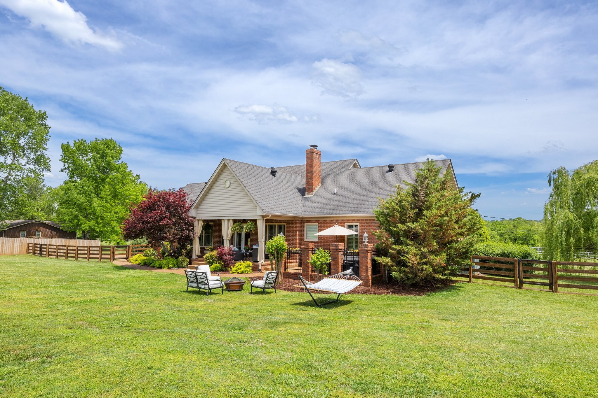 6223 Ladd Road Franklin, TN 37067 - Photo 50 of 67 a view of a house with a big yard potted plants and large tree