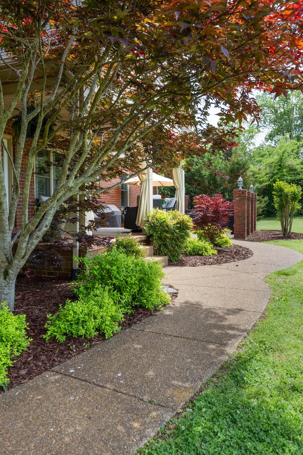 6223 Ladd Road Franklin, TN 37067 - Photo 5 of 67 a front view of a house with a yard and a garage