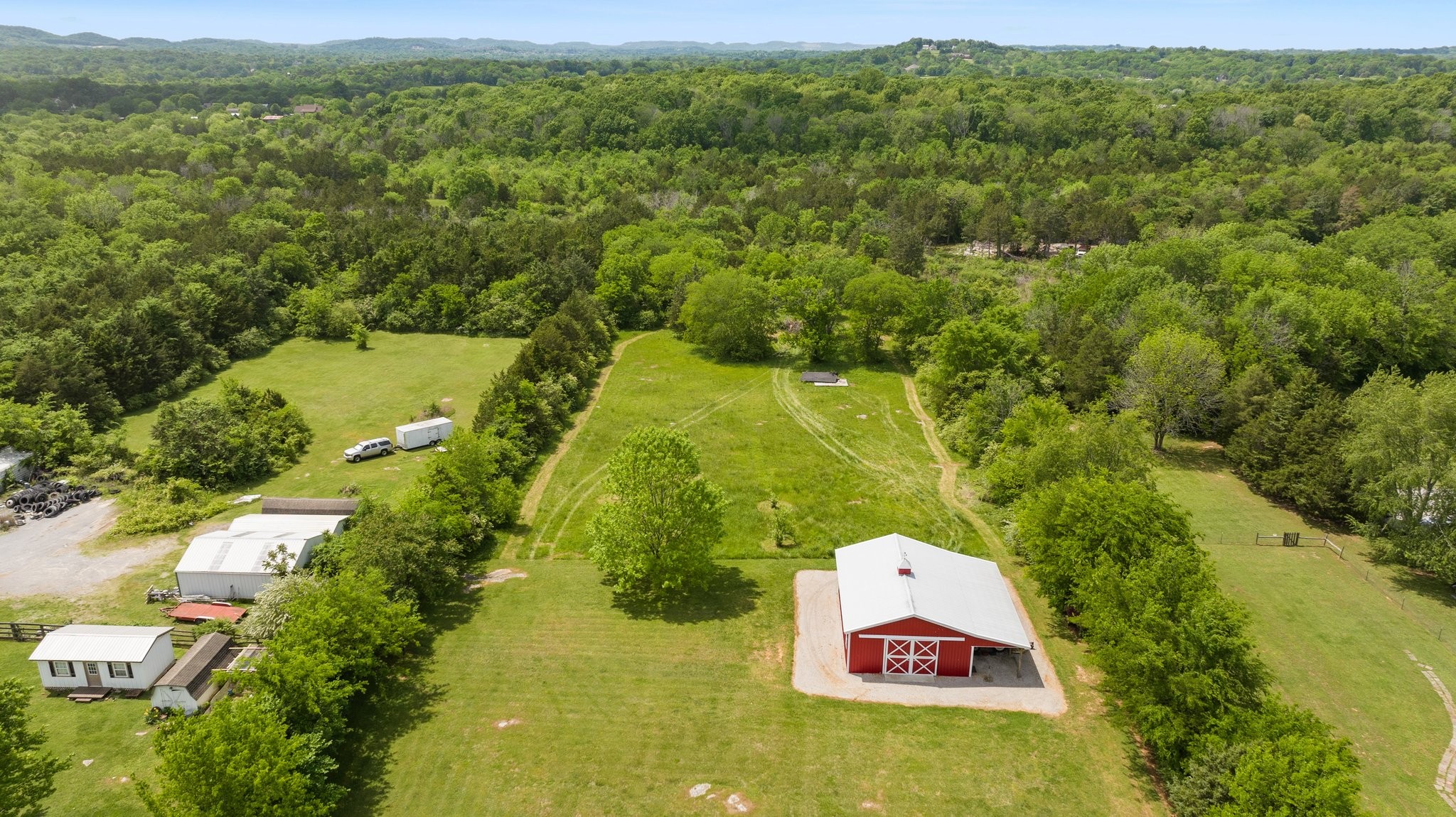 6223 Ladd Road Franklin, TN 37067 - Photo 63 of 67 an aerial view of a residential houses with outdoor space and trees all around