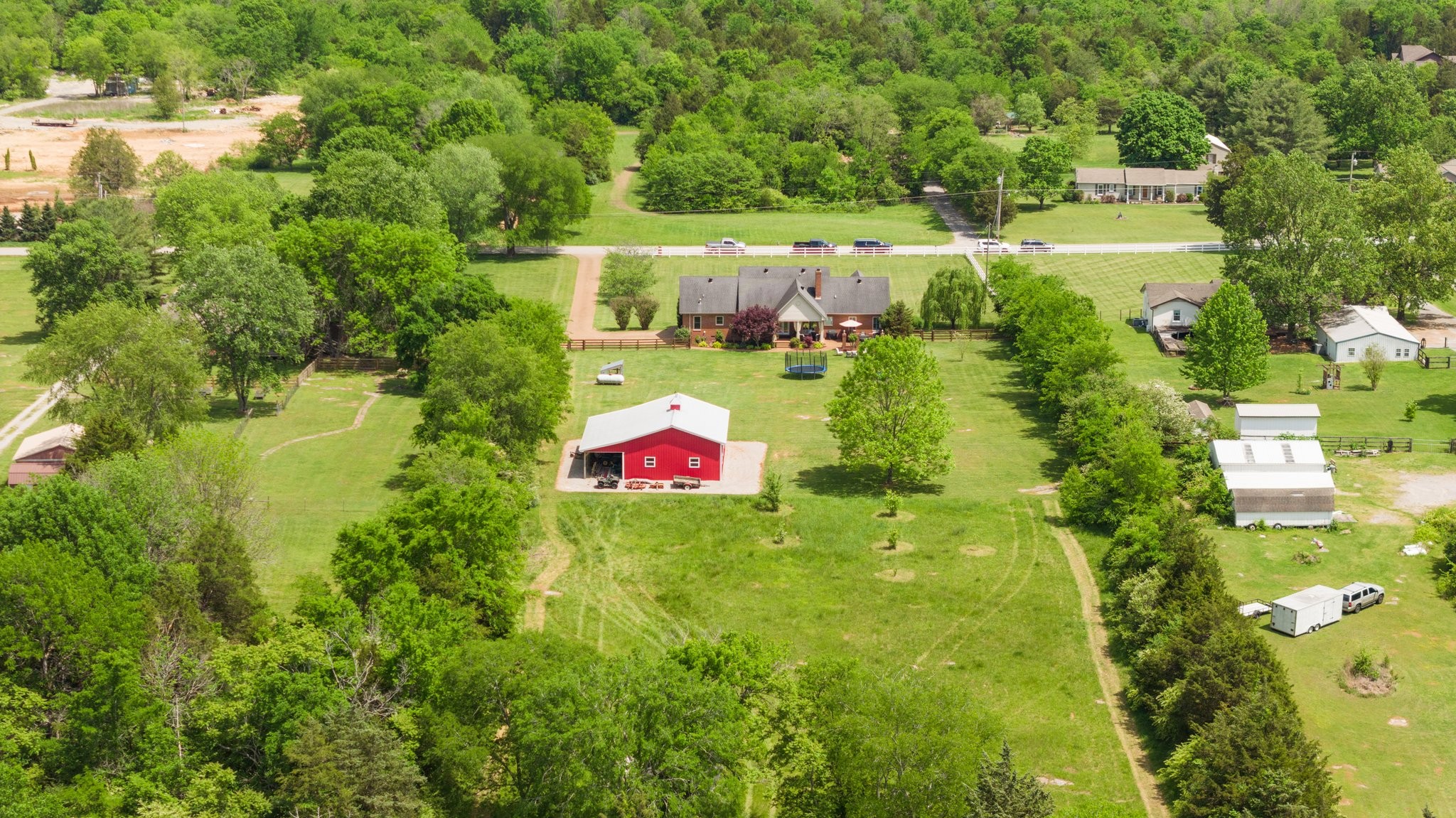 6223 Ladd Road Franklin, TN 37067 - Photo 66 of 67 a backyard of a house with a yard and lake view