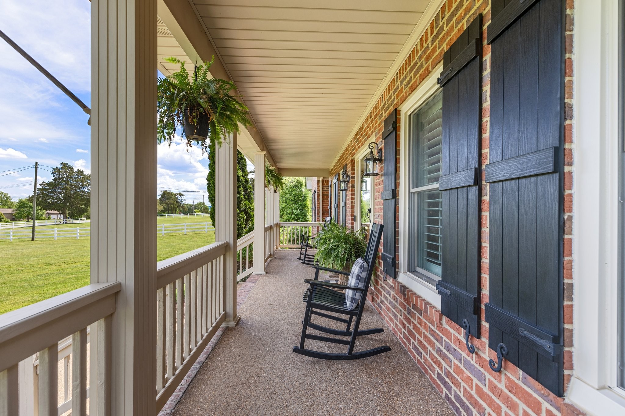 6223 Ladd Road Franklin, TN 37067 - Photo 7 of 67 a porch with a table and chairs next to a yard