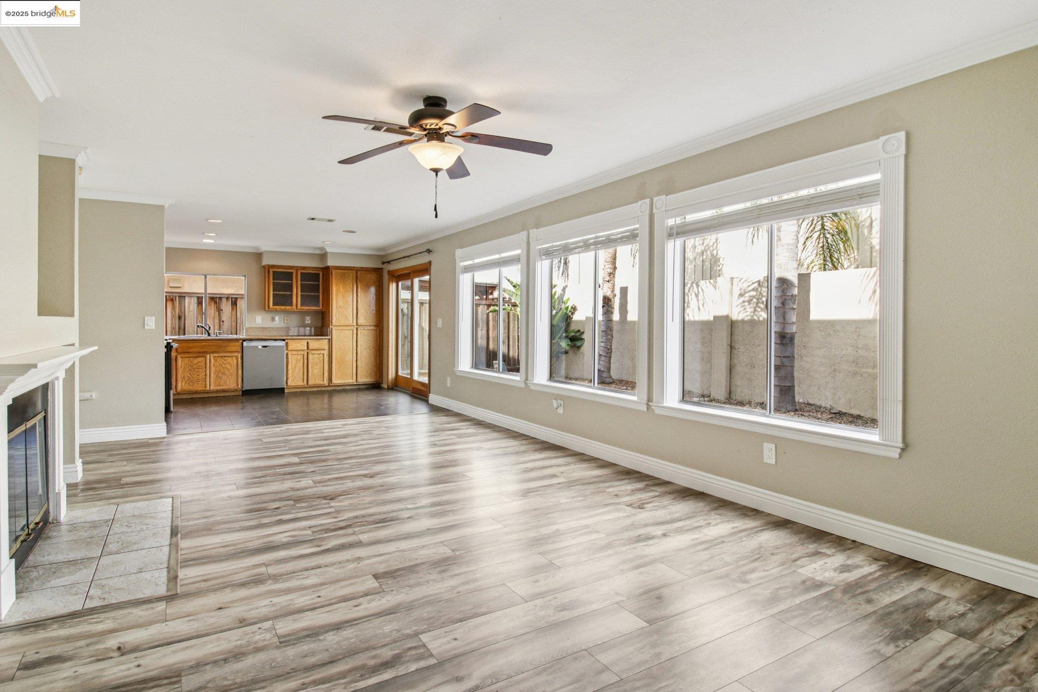 1559 Freed Circle Pittsburg, CA 94565 - Photo 11 of 32 a view of an empty room with a window and wooden floor