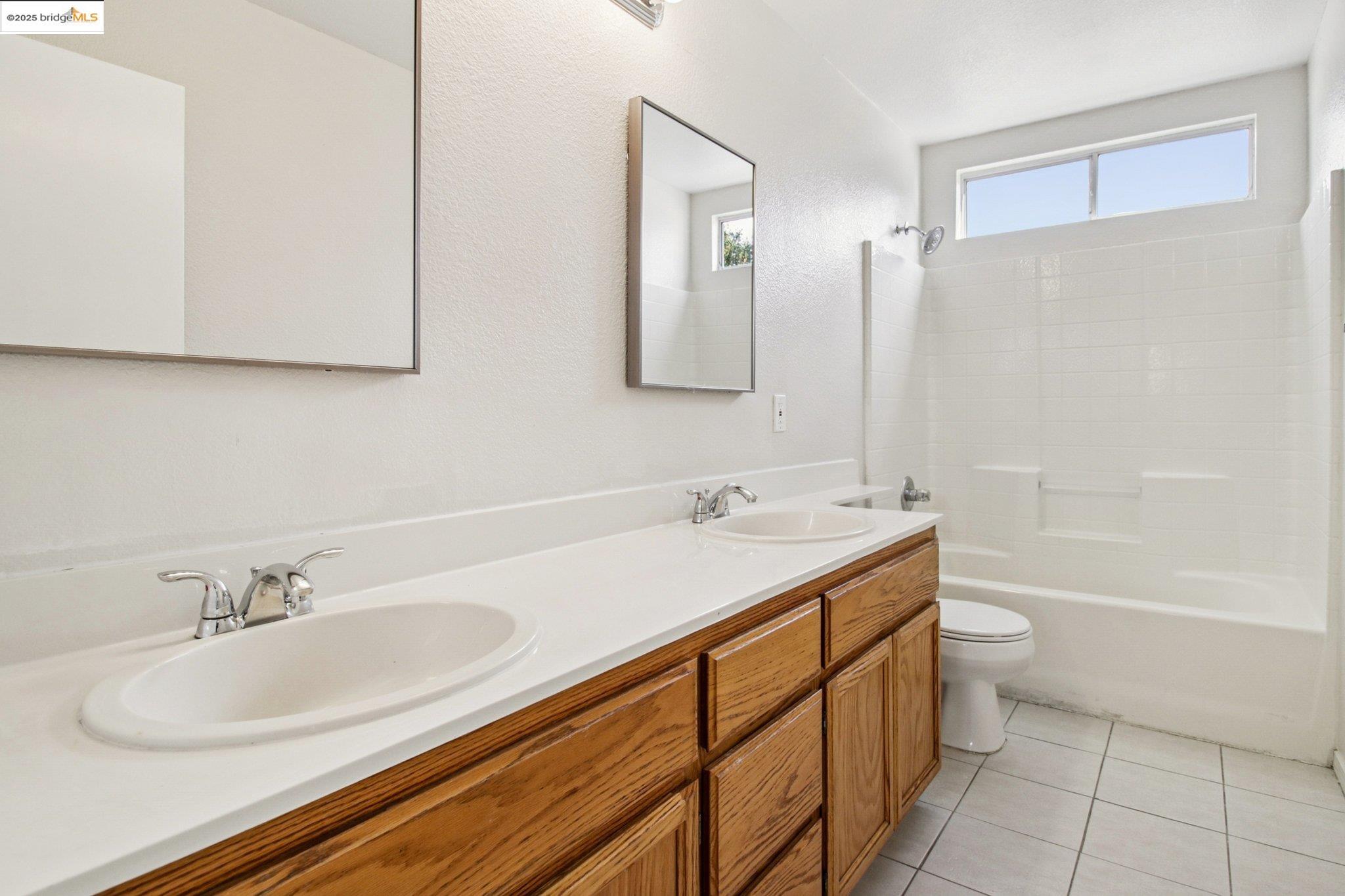 1559 Freed Circle Pittsburg, CA 94565 - Photo 29 of 32 a bathroom with a sink and a mirror