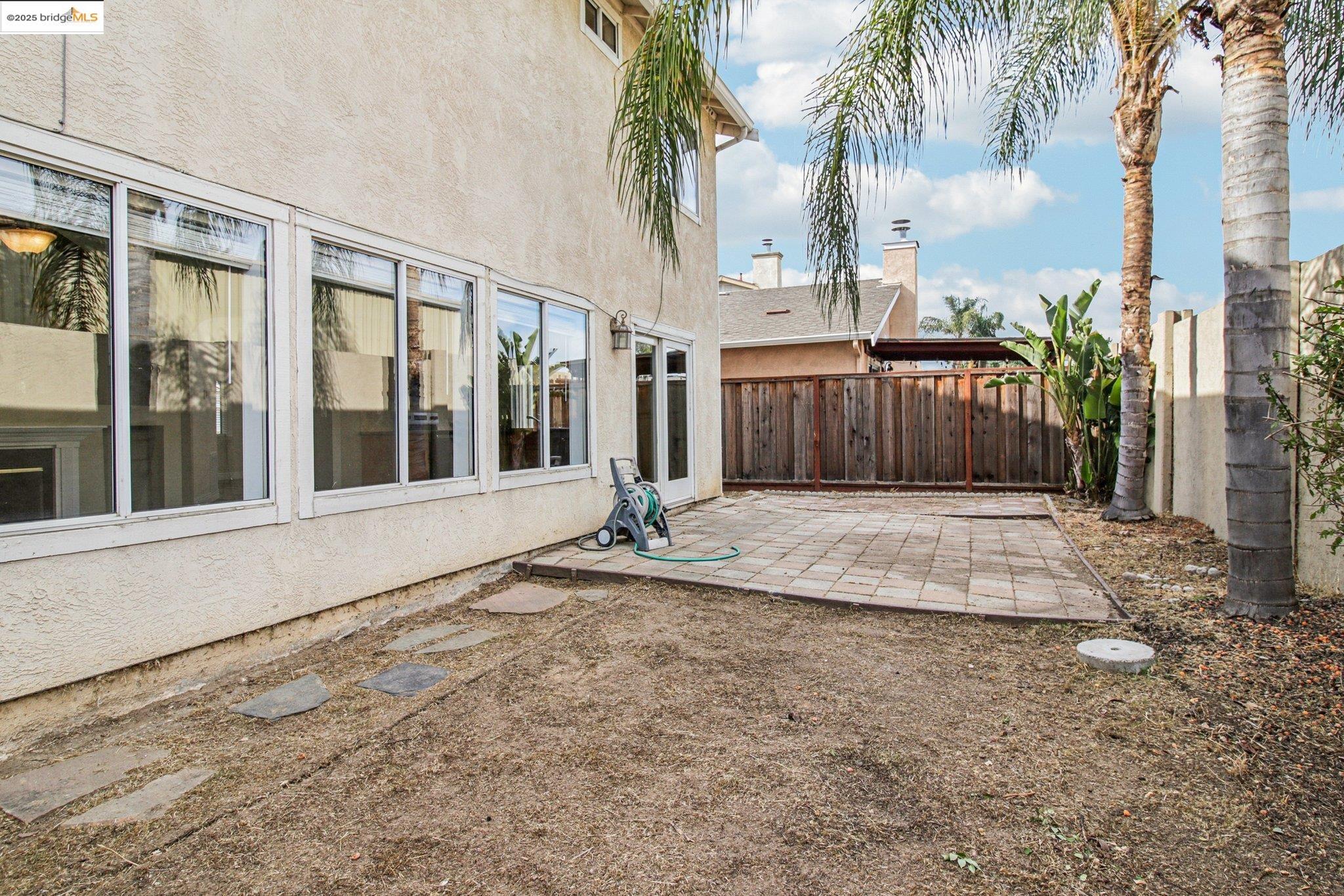 1559 Freed Circle Pittsburg, CA 94565 - Photo 32 of 32 a view of a brick house with a large windows and plants