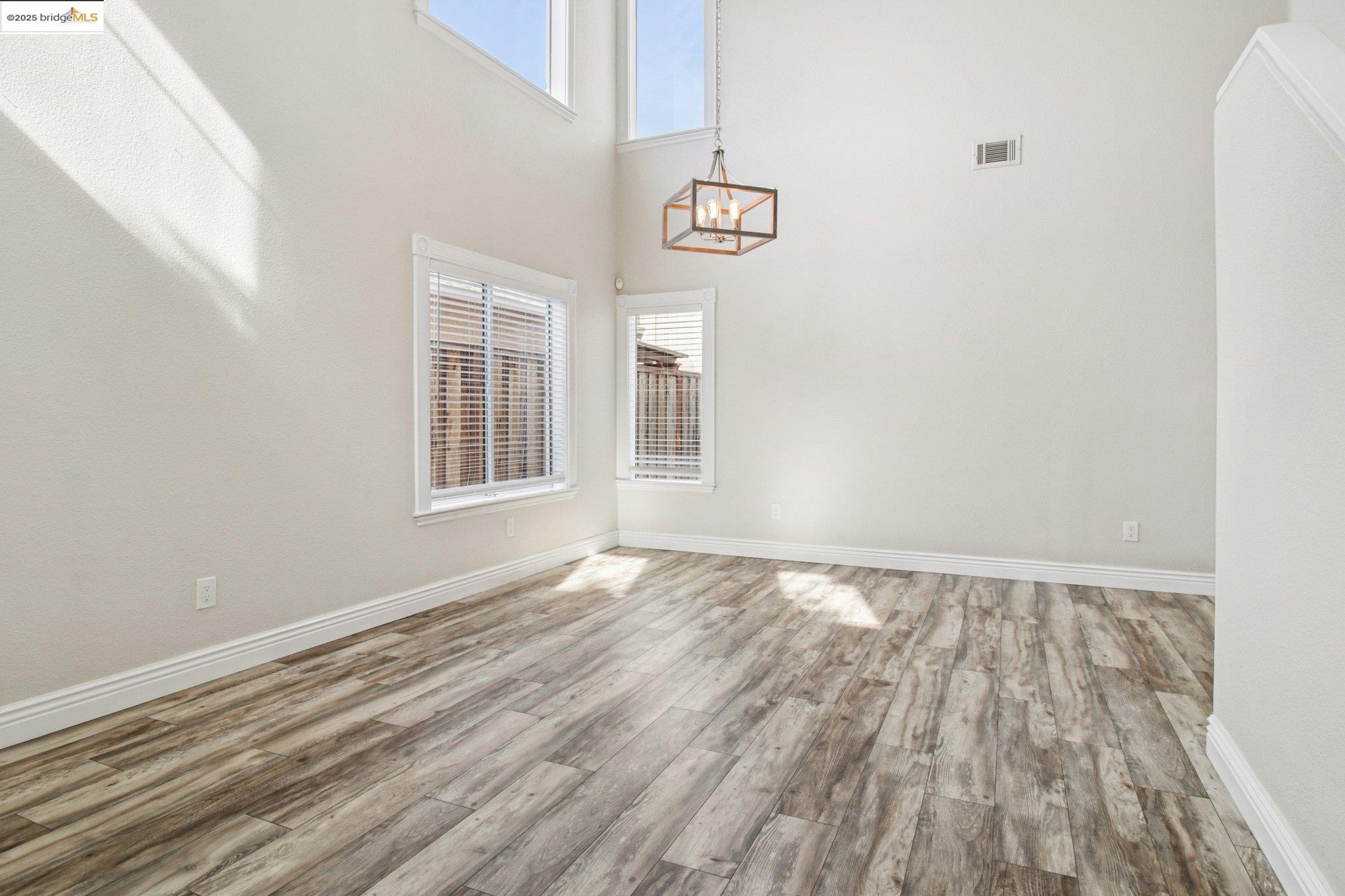 1559 Freed Circle Pittsburg, CA 94565 - Photo 4 of 32 a view of an empty room with wooden floor and a window