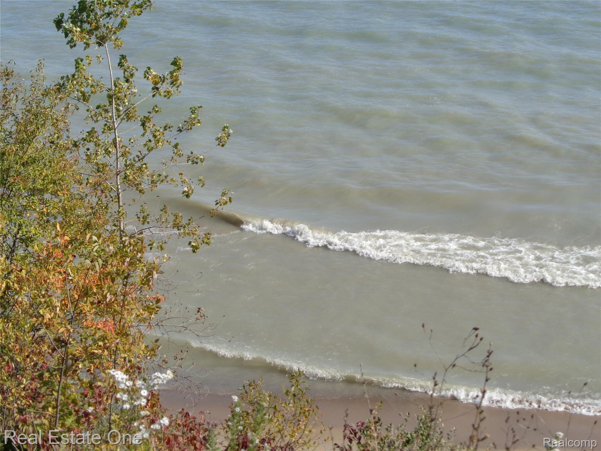 5960 Mills Road Deckerville, MI 48427 - Photo 54 of 79 Looking down over one of the fences. Love hearing the waves crash. Great place to revitalize...