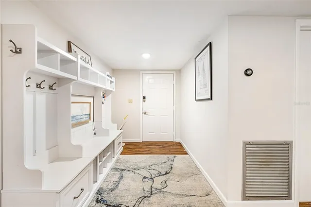 a spacious bathroom with a tub shower and a sink
