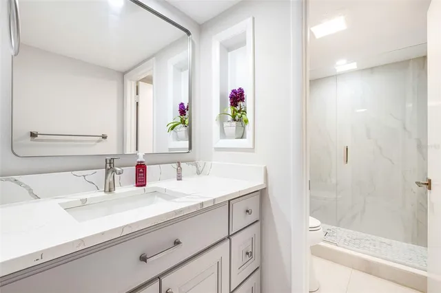 a bathroom with a sink and a mirror